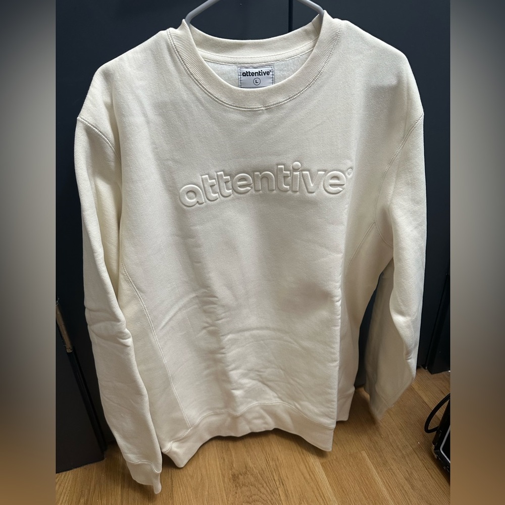 Attentive white sweatshirts